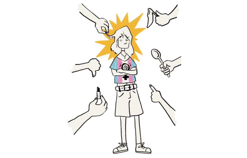 Eine Person mit T-Shirt in den Farben der Transflagge steht im Mittelpunkt. Hände zeigen ins Bild, sie halten Make Up und andere Gegenstände. Die Person trotzt den Aufdringlichkeiten dennoch.